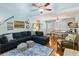 Comfortable living room with hardwood floors, sectional sofa, and dining area in an open layout at 524 Cobby Creek Ln, Seabrook Island, SC 29455