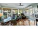 Bright sunroom with hardwood floors, comfortable seating, and large windows offering scenic views at 524 Cobby Creek Ln, Seabrook Island, SC 29455