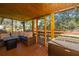 Inviting screened-in back porch with comfortable seating and wooden floors at 6024 Meadowcliff Ave, Hanahan, SC 29410
