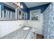 Clean bathroom featuring white tile, a granite counter top, framed mirrors and a decorative shower curtain at 6024 Meadowcliff Ave, Hanahan, SC 29410