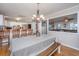 Bright dining area with view of the open-concept kitchen and living room at 6024 Meadowcliff Ave, Hanahan, SC 29410