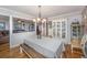 Cozy dining area with hardwood floors, chandelier, and view to another living area at 6024 Meadowcliff Ave, Hanahan, SC 29410