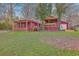 Spacious backyard featuring an outdoor patio area with a large, covered deck perfect for entertainment at 7 Dogwood Ln, Walterboro, SC 29488