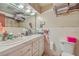 Functional bathroom with a double sink vanity and white tiled walls at 7 Dogwood Ln, Walterboro, SC 29488