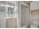 Compact bathroom featuring tiled walls, a shower, and a white vanity with storage at 7 Dogwood Ln, Walterboro, SC 29488