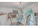 Bright dining area with a glass table and access to the outdoors at 7 Dogwood Ln, Walterboro, SC 29488