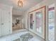 Bright entryway featuring marble floors, a decorative chandelier, and a view into the spacious living area at 7 Dogwood Ln, Walterboro, SC 29488