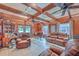 Cozy living room with wood paneling, ceiling beams, and a comfortable leather sofa set at 7 Dogwood Ln, Walterboro, SC 29488