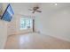 Bright living room featuring tile floors, a ceiling fan, and a window seat area for relaxing at 7 Dogwood Ln, Walterboro, SC 29488