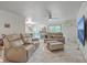 Open-concept living room featuring marble floors, a large television, and comfortable seating at 7 Dogwood Ln, Walterboro, SC 29488