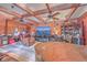 Inviting living room featuring wood ceiling beams and leather furniture arranged around a flat-screen TV at 7 Dogwood Ln, Walterboro, SC 29488