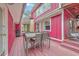 Charming outdoor deck with a rustic dining table, a grill, and a view of the yard at 7 Dogwood Ln, Walterboro, SC 29488