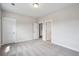 Light-filled bedroom with plush carpeting, base molding, and two doorways at 714 Breakers Reef Ln, Huger, SC 29450