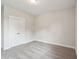 Clean bedroom with plush carpeting, base molding, and a closet with double doors at 714 Breakers Reef Ln, Huger, SC 29450