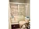 Bathroom with a glass-enclosed shower and bathtub, with a white toilet and neutral decor at 7364 Suncatcher Dr, Hanahan, SC 29410