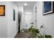 Hallway with vinyl floors, white walls, and a view into the bathroom at 781 E Butternut Rd, Summerville, SC 29483