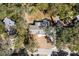 Aerial view of the house, showcases its location among mature trees and well-manicured landscaping at 782 Bonham Dr, Charleston, SC 29412