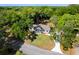 Expansive aerial view of a lovely home nestled among lush trees with a long winding driveway at 782 Bonham Dr, Charleston, SC 29412
