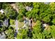 Scenic aerial view of a home with a long drive, mature trees, and a lush green lawn in a quiet neighborhood at 782 Bonham Dr, Charleston, SC 29412