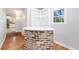 Living area featuring a brick bar, built-in bookshelves, and a sunny window at 782 Bonham Dr, Charleston, SC 29412