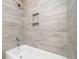 Bathroom featuring modern tile shower with built-in shelves and a luxurious soaking tub at 782 Bonham Dr, Charleston, SC 29412