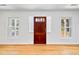 Inviting entryway with hardwood floors, a wooden front door, and flanking windows for ample natural light at 782 Bonham Dr, Charleston, SC 29412