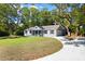 Beautifully renovated home features a lovely front yard, a private drive, and an attached garage at 782 Bonham Dr, Charleston, SC 29412