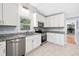 Bright, spacious kitchen with stainless appliances, granite countertops, and ample white cabinetry at 782 Bonham Dr, Charleston, SC 29412