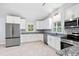 Bright, spacious kitchen with stainless appliances, granite countertops, and ample white cabinetry at 782 Bonham Dr, Charleston, SC 29412