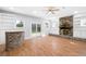 Cozy living room with a brick fireplace, built-in bookshelves, and sliding doors to the yard at 782 Bonham Dr, Charleston, SC 29412