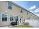 Exterior shot of backyard with string lights, grill, and grassy area at 7857 Montview Rd, North Charleston, SC 29418