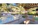 Luxurious backyard features a sparkling pool, fireplace, lounge chairs, and a comfortable seating area at 80 Smith St, Charleston, SC 29401