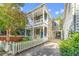 Inviting two-story home with a white picket fence and a lush front yard at 80 Smith St, Charleston, SC 29401