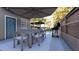 Outdoor patio with a dining set, umbrella, and barbecue grill at 80 Smith St, Charleston, SC 29401