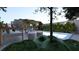 Backyard pool with cozy seating areas and lush landscaping, perfect for entertaining or unwinding at 80 Smith St, Charleston, SC 29401