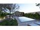 Landscaped pool area featuring a sleek pool with a sundeck, pergola, and inviting lounge furniture at 80 Smith St, Charleston, SC 29401