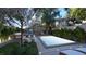 Inviting backyard with a sparkling pool, comfortable seating, and lush landscaping for serene relaxation at 80 Smith St, Charleston, SC 29401
