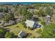 Expansive aerial view of charming home, lush landscaping and beautiful waterfront surroundings at 901 Morton Waring Ln, Pinopolis, SC 29469