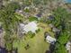 An expansive property with a well-kept house, green lawn, mature trees, and extra buildings at 901 Morton Waring Ln, Pinopolis, SC 29469