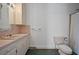 Bathroom featuring a vanity with sink, toilet, shower with curtain and updated hardware at 901 Morton Waring Ln, Pinopolis, SC 29469