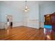 Large bedroom featuring hardwood floors, neutral walls, and natural light from windows at 901 Morton Waring Ln, Pinopolis, SC 29469