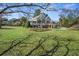 Exterior view of the home with a large yard at 901 Morton Waring Ln, Pinopolis, SC 29469