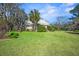 Well-maintained home exterior with lush lawn, and mature trees at 901 Morton Waring Ln, Pinopolis, SC 29469
