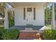 Inviting front porch with brick steps and decorative plants at 901 Morton Waring Ln, Pinopolis, SC 29469