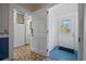 Hallway with tile flooring, beadboard walls, and an exterior access door at 901 Morton Waring Ln, Pinopolis, SC 29469