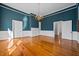 Bright living room featuring hardwood floors, blue walls, and natural light from multiple windows at 901 Morton Waring Ln, Pinopolis, SC 29469