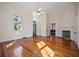 Bright living room with hardwood floors and a decorative fireplace at 901 Morton Waring Ln, Pinopolis, SC 29469