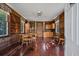 Cozy living room featuring wood paneling, wood floors, and ample natural light at 901 Morton Waring Ln, Pinopolis, SC 29469