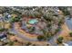 An aerial view of a community pool, playground, and clubhouse in a neighborhood setting at 9690 Seminole Way Way, Summerville, SC 29485