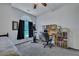 Bright room with a trundle bed, a desk with a chair, an exercise bike, and an arched window at 106 Ranworth Ln, Summerville, SC 29485